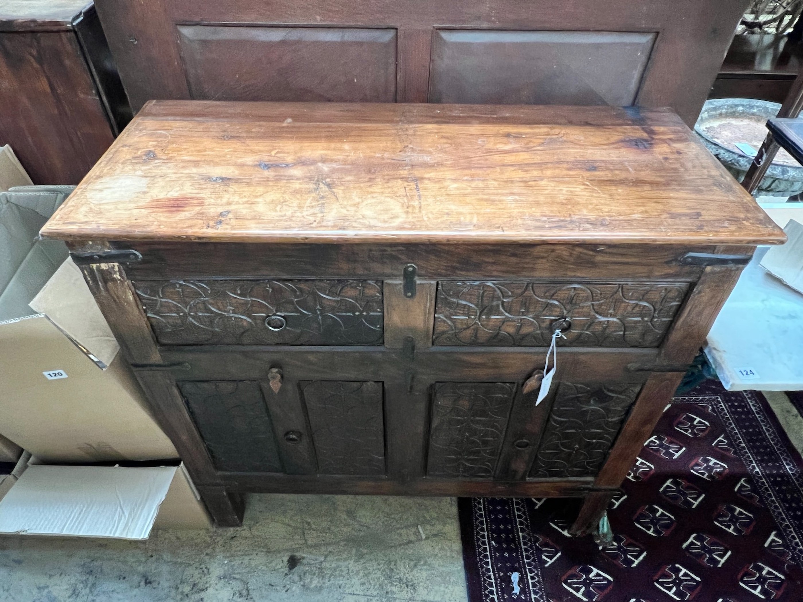 An Indian carved hardwood side cabinet, width 97cm, depth 41cm, height 93cm